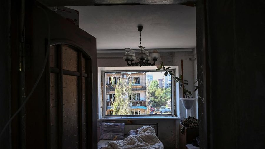 A local resident sleeps in his flat in an apartment building damaged during a Russian missile strike, amid Russia's attack on Ukraine, in Pokrovsk, Donetsk region, Ukraine August 8, 2023. REUTERS/Viacheslav Ratynskyi