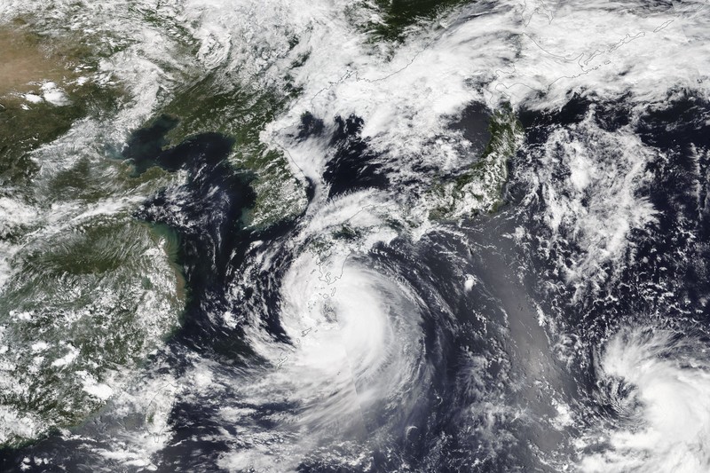 Fishing boats are anchored in a port as Tropical Storm Khanun approaches to Korean peninsular on Jeju Island, Wednesday, Aug. 9, 2023. Dozens of flights and ferry services were grounded in South Korea on Wednesday ahead of the tropical storm that has dumped rain on Japan's southwestern islands for more than a week. (Park Ji-ho/Yonhap via AP)