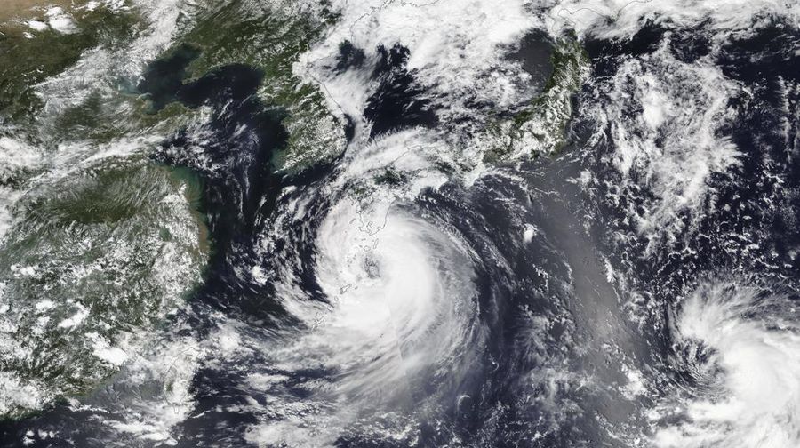 Fishing boats are anchored in a port as Tropical Storm Khanun approaches to Korean peninsular on Jeju Island, Wednesday, Aug. 9, 2023. Dozens of flights and ferry services were grounded in South Korea on Wednesday ahead of the tropical storm that has dumped rain on Japan's southwestern islands for more than a week. (Park Ji-ho/Yonhap via AP)