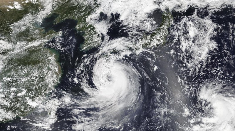 Fishing boats are anchored in a port as Tropical Storm Khanun approaches to Korean peninsular on Jeju Island, Wednesday, Aug. 9, 2023. Dozens of flights and ferry services were grounded in South Korea on Wednesday ahead of the tropical storm that has dumped rain on Japan's southwestern islands for more than a week. (Park Ji-ho/Yonhap via AP)