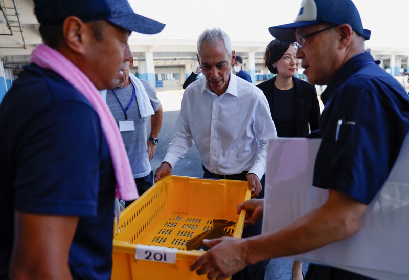 U.S. Ambassador to Japan Rahm Emanuel eats lunch with Soma Mayor Hidekiyo Tachiya at Restaurant Takohachi during his visit to show his support for the water discharge from the Fukushima Daiichi nuclear power plant, in Soma, Fukushima Prefecture, Japan, August 31, 2023. REUTERS/Kim Kyung-Hoon