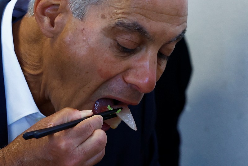 U.S. Ambassador to Japan Rahm Emanuel eats lunch with Soma Mayor Hidekiyo Tachiya at Restaurant Takohachi during his visit to show his support for the water discharge from the Fukushima Daiichi nuclear power plant, in Soma, Fukushima Prefecture, Japan, August 31, 2023. REUTERS/Kim Kyung-Hoon