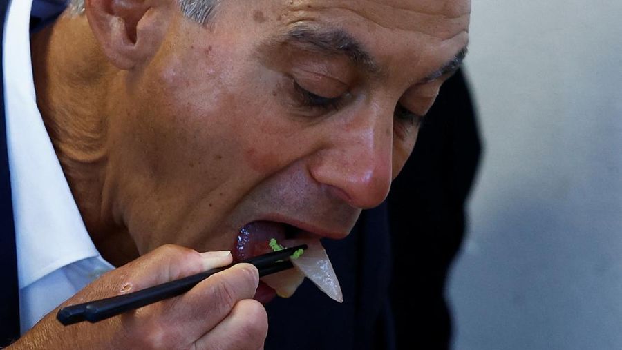 U.S. Ambassador to Japan Rahm Emanuel eats lunch with Soma Mayor Hidekiyo Tachiya at Restaurant Takohachi during his visit to show his support for the water discharge from the Fukushima Daiichi nuclear power plant, in Soma, Fukushima Prefecture, Japan, August 31, 2023. REUTERS/Kim Kyung-Hoon