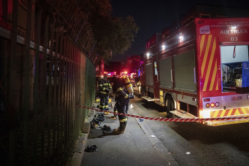 South Africa Fire Fire fighters work on the scene of a deadly blaze in downtown Johannesburg Thursday, Aug. 31, 2023. Scores of people died when a fire ripped through a multi-story building in Johannesburg, South Africa’s biggest city, emergency services said Thursday. (AP Photo)