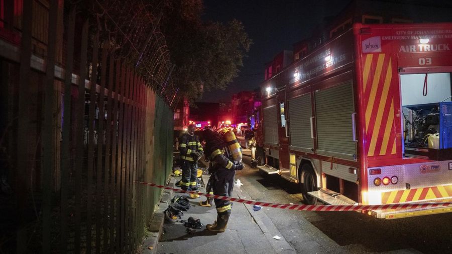 Fire fighters work on the scene of a deadly blaze in downtown Johannesburg Thursday, Aug. 31, 2023. Scores of people died when a fire ripped through a multi-story building in Johannesburg, South Africa’s biggest city, emergency services said Thursday. (AP Photo)