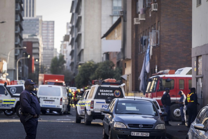 South Africa Fire Fire fighters work on the scene of a deadly blaze in downtown Johannesburg Thursday, Aug. 31, 2023. Scores of people died when a fire ripped through a multi-story building in Johannesburg, South Africa’s biggest city, emergency services said Thursday. (AP Photo)