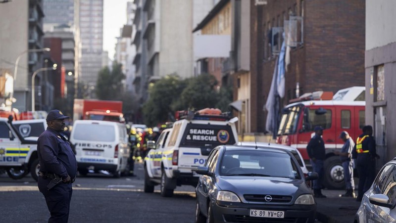 Fire fighters work on the scene of a deadly blaze in downtown Johannesburg Thursday, Aug. 31, 2023. Scores of people died when a fire ripped through a multi-story building in Johannesburg, South Africa’s biggest city, emergency services said Thursday. (AP Photo)