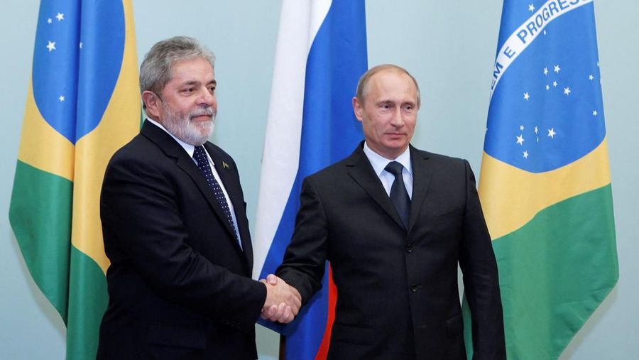 FILE PHOTO: Brazil's President Luiz Ignacio Lula da Silva (L) shakes hands with Russia's Prime Minister Vladimir Putin as they meet in Moscow May 14, 2010. REUTERS/Ria Novosti/Pool/Alexei Druzhinin/File Photo