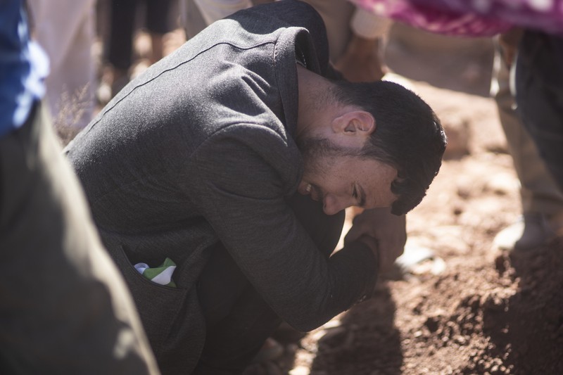 Mohammed Elhmatif and his sons, Rayan, right, and Ali, stand amidst the rubble of their home which was damaged by the earthquake, in Ijjoukak village, near Marrakech, Morocco, Saturday, Sept. 9, 2023. A rare, powerful earthquake struck Morocco, sending people racing from their beds into the streets and toppling buildings in mountainous villages and ancient cities not built to withstand such force. (AP Photo/Mosa'ab Elshamy)
