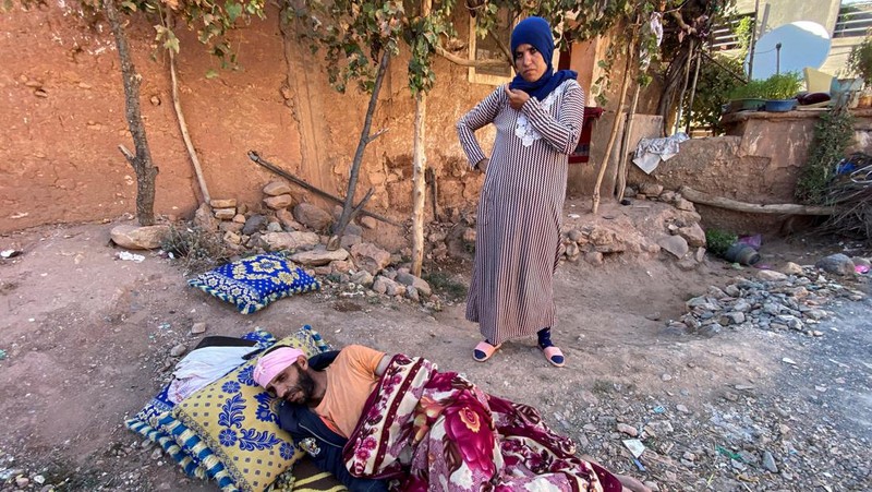 Residents sleep on the street in Moulay Brahim village, in the province of Al Haouz, following a powerful earthquake in Morocco, September 9, 2023. REUTERS/Nacho Doce