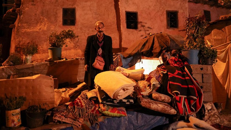 Mohammed Elhmatif and his sons, Rayan, right, and Ali, stand amidst the rubble of their home which was damaged by the earthquake, in Ijjoukak village, near Marrakech, Morocco, Saturday, Sept. 9, 2023. A rare, powerful earthquake struck Morocco, sending people racing from their beds into the streets and toppling buildings in mountainous villages and ancient cities not built to withstand such force. (AP Photo/Mosa'ab Elshamy)