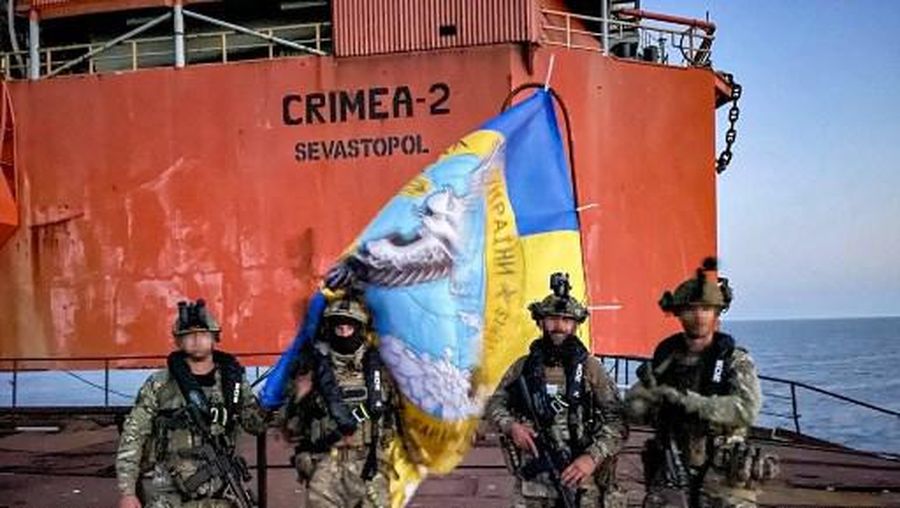This undated handout photograph posted on September 11, 2023, on the Telegram account of the Defence Intelligence of the Ministry of Defence of Ukraine reportedly shows Ukrainian military members standing on an oil and gas drilling platform in the Black Sea. Ukrainian forces have retaken control of an oil and gas drilling platform in the Black Sea that had been controlled by Moscow since 2015, Kyiv announced on September 11, 2023. 