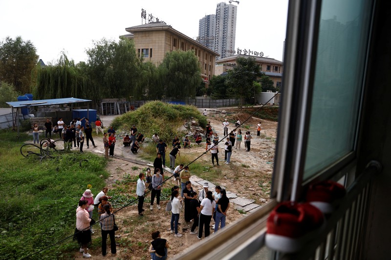 Kisah pembeli proyek apartemen di provinsi Shaanxi, China. (REUTERS/Tingshu Wang) Kisah pembeli proyek apartemen mangkrak di provinsi Shaanxi, China. (REUTERS/Tingshu Wang)