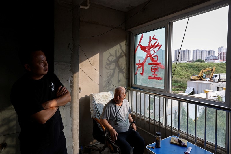 Kisah pembeli proyek apartemen di provinsi Shaanxi, China. (REUTERS/Tingshu Wang) Kisah pembeli proyek apartemen mangkrak di provinsi Shaanxi, China. (REUTERS/Tingshu Wang)