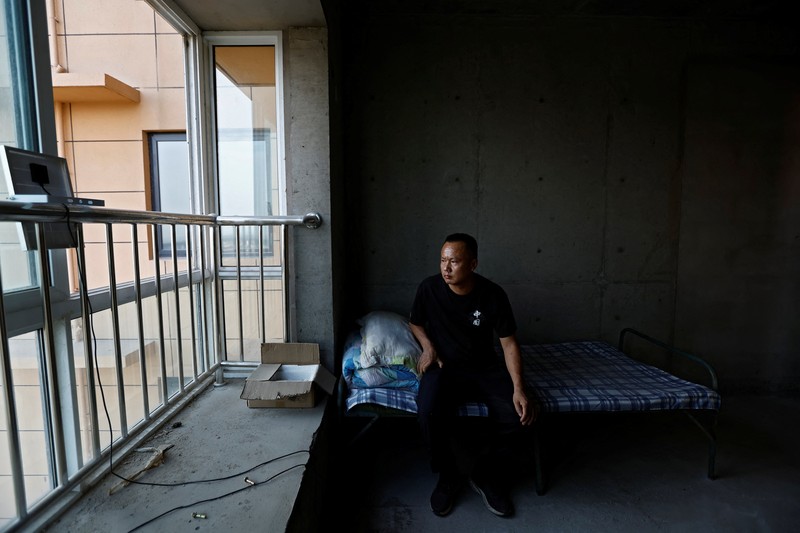 Kisah pembeli proyek apartemen di provinsi Shaanxi, China. (REUTERS/Tingshu Wang) Kisah pembeli proyek apartemen mangkrak di provinsi Shaanxi, China. (REUTERS/Tingshu Wang)