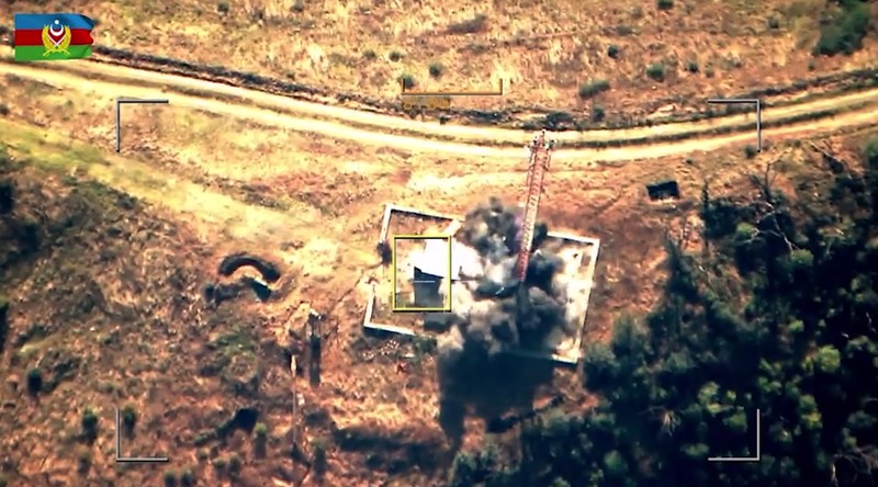 In this photo taken from video released by Defense Ministry of Azerbaijan on Tuesday, Sept. 19, 2023, smoke rises over an area which Azerbaijan says hosts Armenian forces' positions in the breakaway territory of Nagorno-Karabakh in Azerbaijan. Azerbaijan on Tuesday declared that it started what it called an 