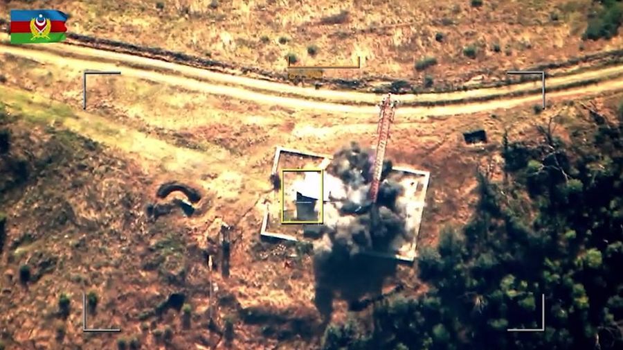In this photo taken from video released by Defense Ministry of Azerbaijan on Tuesday, Sept. 19, 2023, smoke rises over an area which Azerbaijan says hosts Armenian forces' positions in the breakaway territory of Nagorno-Karabakh in Azerbaijan. Azerbaijan on Tuesday declared that it started what it called an 