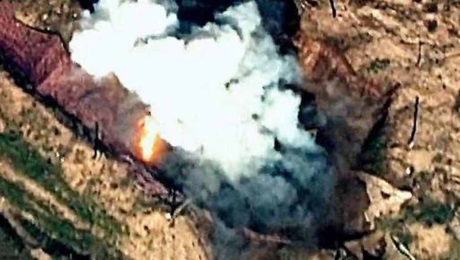 This grab taken from a handout footage released by the Azerbaijani Defence Ministry on September 19, 2023 show an explosion, that Baku claims to be Azerbaijani forces 