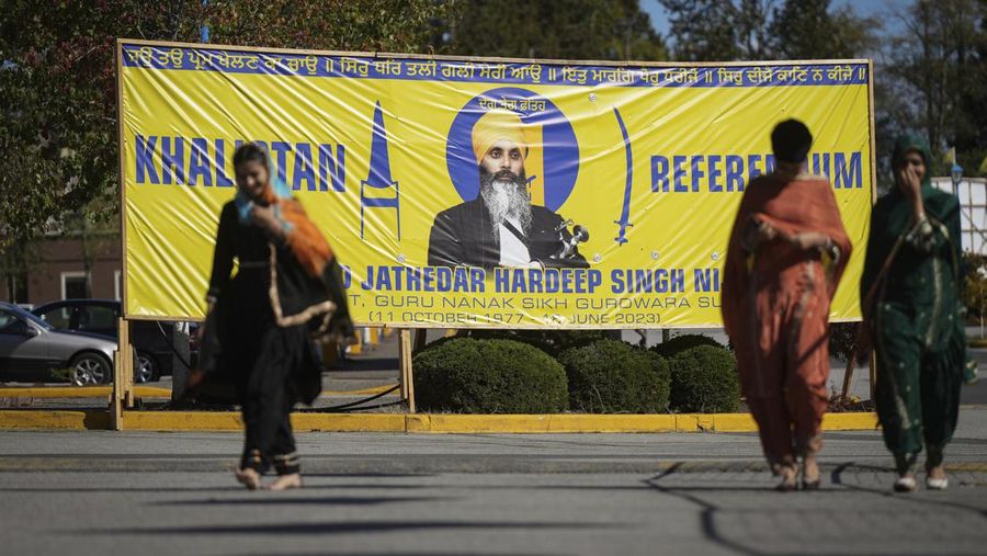 A photograph of late temple president Hardeep Singh Nijjar is seen on a banner outside the Guru Nanak Sikh Gurdwara Sahib in Surrey, British Columbia, on Monday, Sept. 18, 2023, where temple president Hardeep Singh Nijjar was gunned down in his vehicle while leaving the temple parking lot in June. Canada expelled a top Indian diplomat Monday as it investigates what Prime Minister Justin Trudeau called credible allegations that India’s government may have had links to the assassination in Canada of a Sikh activist.(Darryl Dyck/The Canadian Press via AP)