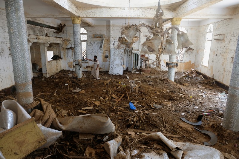 LIBYA-STORM/DERNA A man inspects a damaged mosque, in the aftermath of a deadly storm and flooding that hit Libya, in Derna, Libya September 20, 2023. REUTERS/Esam Omran Al-fetori