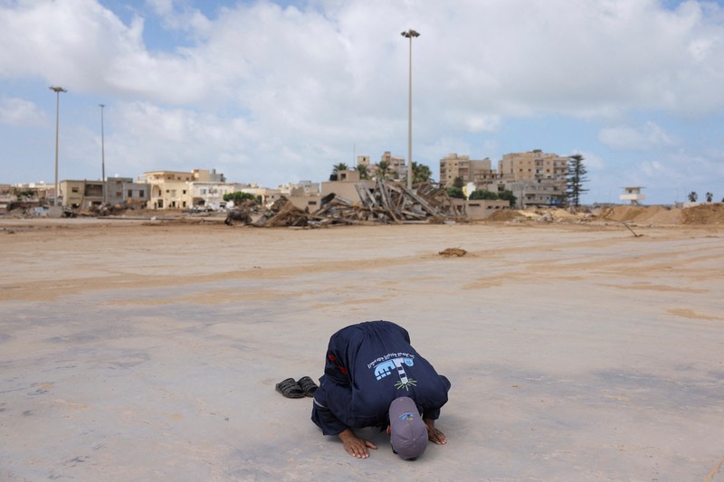 A man inspects a damaged mosque, in the aftermath of a deadly storm and flooding that hit Libya, in Derna, Libya September 20, 2023. REUTERS/Esam Omran Al-fetori