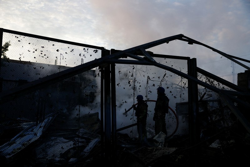 A firefighter works at a site in a residential area, damaged during a Russian missile strike, amid Russia’s attack on Ukraine, in Kyiv, Ukraine September 21, 2023. REUERS/Valentyn Ogirenko