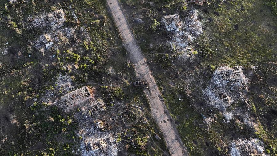 Houses and armoured vehicle destroyed during the fighting between Russian and Ukrainian armed forces are seen in recently liberated Klishchiivka, Donetsk region, Ukraine, Sunday, Sept. 24, 2023. (AP Photo/Alex Babenko).