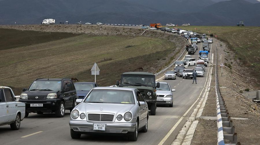 A convoy of cars of ethnic Armenians from Nagorno-Karabakh move to Kornidzor in Syunik region, Armenia, Tuesday, Sept. 26, 2023. Thousands of Armenians have streamed out of Nagorno-Karabakh after the Azerbaijani military reclaimed full control of the breakaway region last week. (AP Photo/Vasily Krestyaninov)