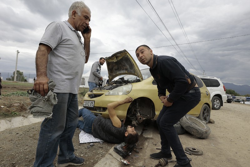 A convoy of cars of ethnic Armenians from Nagorno-Karabakh move to Kornidzor in Syunik region, Armenia, Tuesday, Sept. 26, 2023. Thousands of Armenians have streamed out of Nagorno-Karabakh after the Azerbaijani military reclaimed full control of the breakaway region last week. (AP Photo/Vasily Krestyaninov)