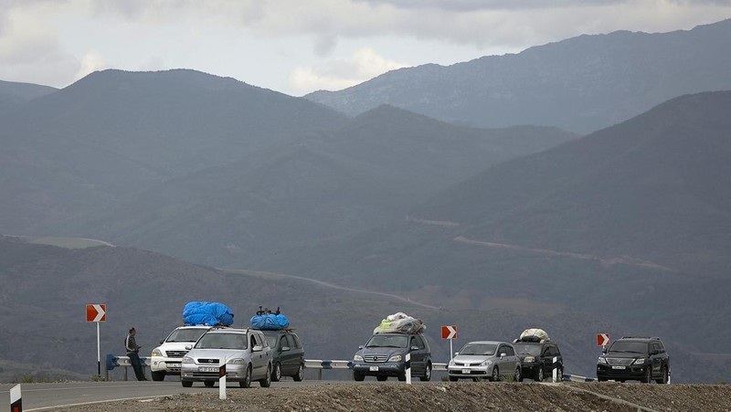 A convoy of cars of ethnic Armenians from Nagorno-Karabakh move to Kornidzor in Syunik region, Armenia, Tuesday, Sept. 26, 2023. Thousands of Armenians have streamed out of Nagorno-Karabakh after the Azerbaijani military reclaimed full control of the breakaway region last week. (AP Photo/Vasily Krestyaninov)