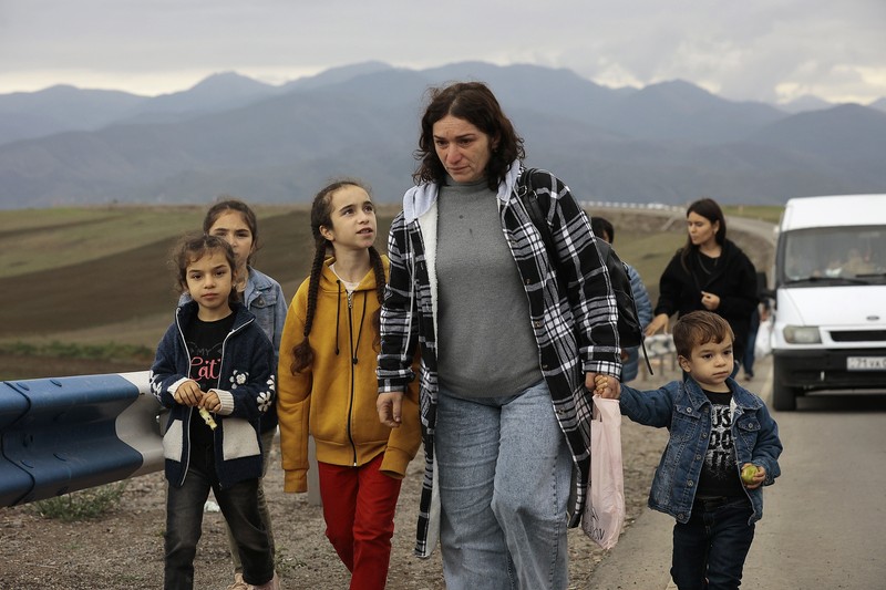 A convoy of cars of ethnic Armenians from Nagorno-Karabakh move to Kornidzor in Syunik region, Armenia, Tuesday, Sept. 26, 2023. Thousands of Armenians have streamed out of Nagorno-Karabakh after the Azerbaijani military reclaimed full control of the breakaway region last week. (AP Photo/Vasily Krestyaninov)