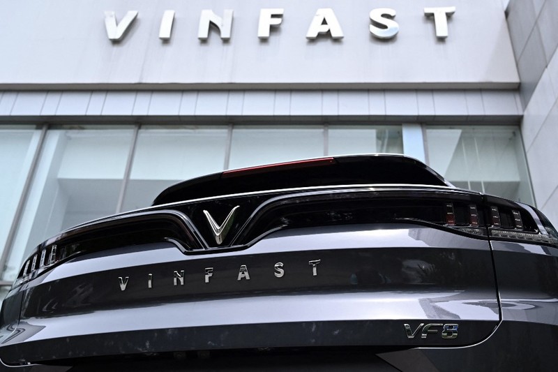 Two men walk outside the main entrance of VinFast, an automotive startup manufacturer in Hai Phong, Vietnam Wednesday, Feb. 27, 2019. As North Korean leader Kim Jong Un prepared for his second summit with President Donald Trump, top members of his delegation made a whirlwind tour of one of Vietnam’s most successful conglomerates. (AP Photo/Minh Hoang)
