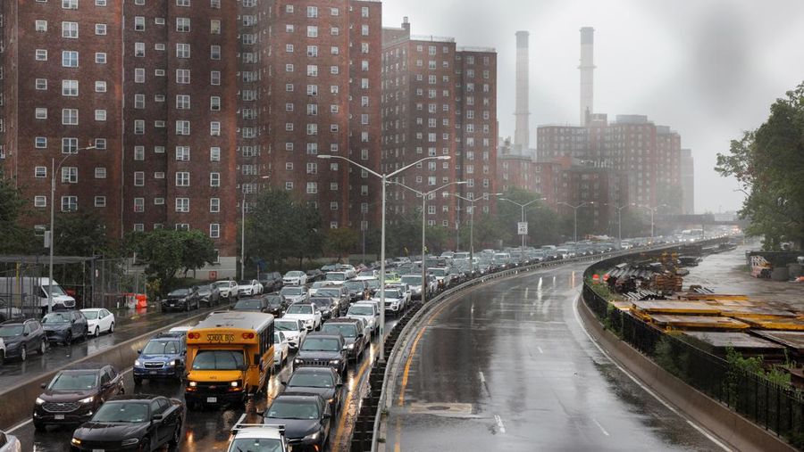 Cars sit on a road as the remnants of Tropical Storm Ophelia bring flooding across the mid-Atlantic and Northeast, in New York City, U.S., September 29, 2023.  REUTERS/Andrew Kelly