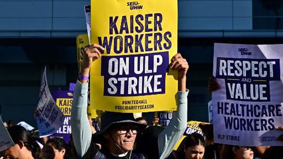 Kaiser Permanente employees, joined by Union members representing the workers, walk the picket line in Los Angeles, California on October 4, 2023. More than 75,000 employees at Kaiser Permanente began one of the largest healthcare worker strikes in recent US history on Wednesday after failing to resolve a dispute over staffing levels. (Photo by Frederic J. BROWN / AFP)