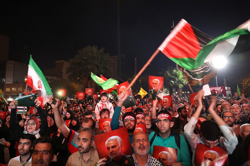 ISRAEL-PALESTINIANS/GAZA-IRAN Iranian celebrate during a gathering in support of Palestinians, in Tehran, Iran, October 7, 2023. Majid Asgaripour/WANA (West Asia News Agency) via REUTERS. ATTENTION EDITORS - THIS IMAGE HAS BEEN SUPPLIED BY A THIRD PARTY.