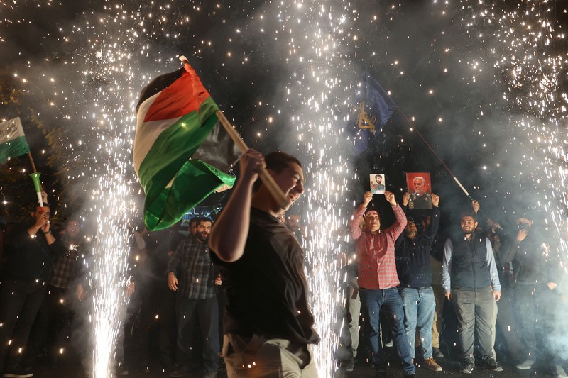 ISRAEL-PALESTINIANS/GAZA-IRAN Iranian celebrate during a gathering in support of Palestinians, in Tehran, Iran, October 7, 2023. Majid Asgaripour/WANA (West Asia News Agency) via REUTERS. ATTENTION EDITORS - THIS IMAGE HAS BEEN SUPPLIED BY A THIRD PARTY.
