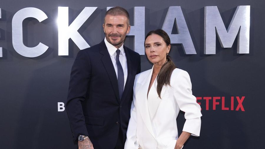 David Beckham dan Victoria Beckham. (AP Photo/Vianney Le Caer)