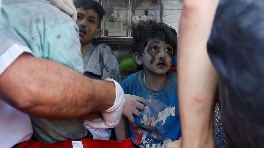 SENSITIVE MATERIAL. THIS IMAGE MAY OFFEND OR DISTURB    A Palestinian boy who was wounded in Israeli strikes on a house sits in an ambulance, in Khan Younis in the southern Gaza Strip  October 11, 2023. REUTERS/Ibraheem Abu Mustafa