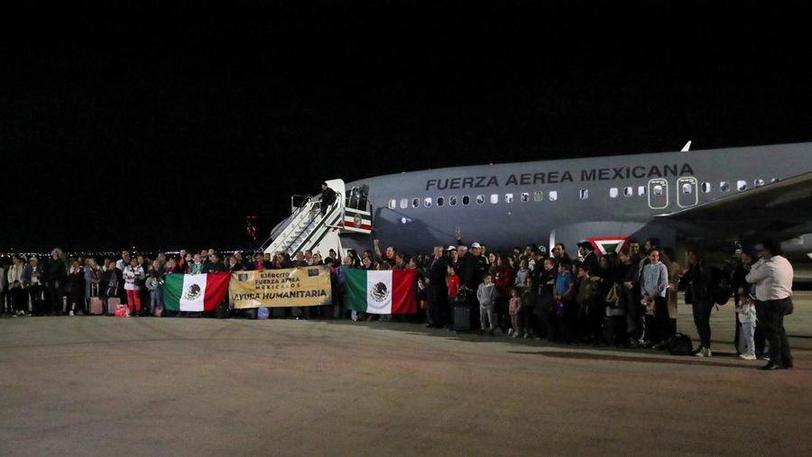 Mexicans repatriated from Tel Aviv, pose for a picture after arriving on a flight of the Mexican Secretariat of National Defense (SEDENA), at the Santa Lucia Air Base, on the outskirts of Mexico City, Mexico, October 11, 2023. REUTERS/Henry Romero