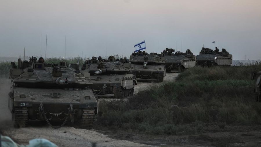 Israeli tanks from an artillery unit are seen near Israel's border with the Gaza Strip, in southern Israel, October 12, 2023. REUTERS/Ronen Zvulun