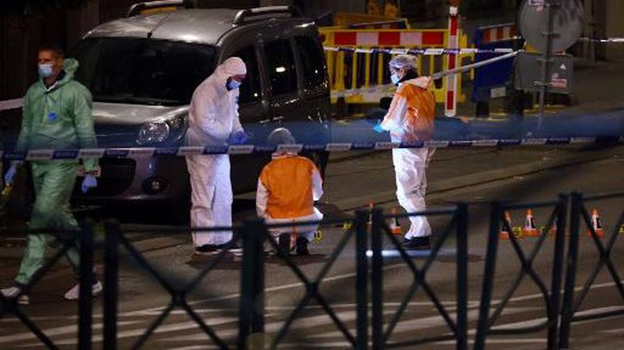 Belgian police officers from the forensic service search for evidence in a street after two people were killed during a shooting in Brussels on October 16, 2023 evening by a suspect who is on the run, the Belgian capital's prosecutor's office said. Two Swedish nationals were shot dead in Brussels late Monday by a suspect who remains at large, in an attack the Belgian prime minister described as 