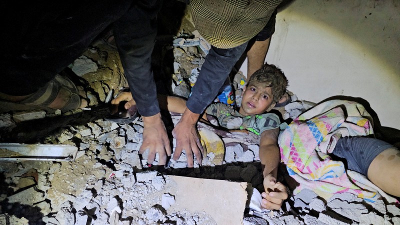 Israel Palestinians Daily Photo Gallery Rockets are fired from the Gaza Strip toward Israel over destroyed buildings following Israeli airstrikes on Gaza City, central Gaza Strip, Thursday, Oct. 19, 2023. (AP Photo/Mohammed Dahman)