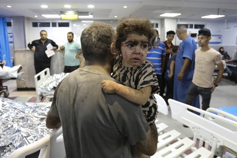 Israel Palestinians Daily Photo Gallery Rockets are fired from the Gaza Strip toward Israel over destroyed buildings following Israeli airstrikes on Gaza City, central Gaza Strip, Thursday, Oct. 19, 2023. (AP Photo/Mohammed Dahman)