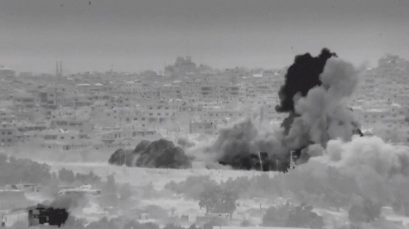 Kendaraan lapis baja Israel mengambil bagian dalam operasi, ketika konflik antara Israel dan Hamas berlanjut, di lokasi yang disebut sebagai Jalur Gaza utara dalam gambar diam yang diambil dari video selebaran yang dirilis pada 26 Oktober 2023. (Israel Defense Forces/Handout via REUTERS)