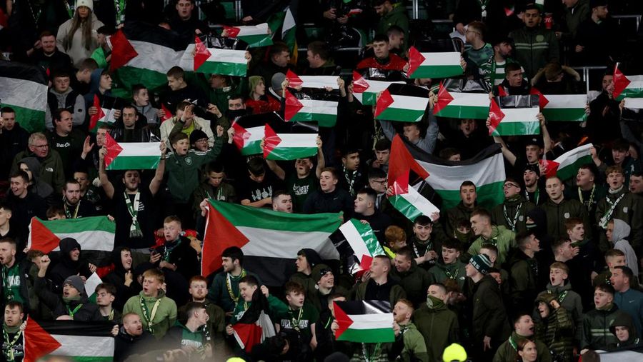 Soccer Football - Champions League - Group E - Celtic v Atletico Madrid - Celtic Park, Glasgow, Scotland, Britain - October 25, 2023 Celtic fans display Palestinian flags in support of Palestine amid the ongoing conflict between Israel and the Palestinian Islamist group Hamas before the match Action Images via Reuters/Jason Cairnduff