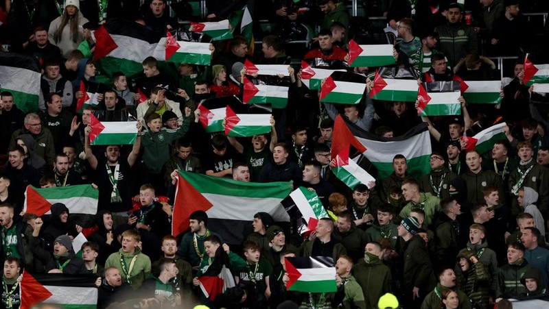 Soccer Football - Champions League - Group E - Celtic v Atletico Madrid - Celtic Park, Glasgow, Scotland, Britain - October 25, 2023 Celtic fans display Palestinian flags in support of Palestine amid the ongoing conflict between Israel and the Palestinian Islamist group Hamas before the match Action Images via Reuters/Jason Cairnduff