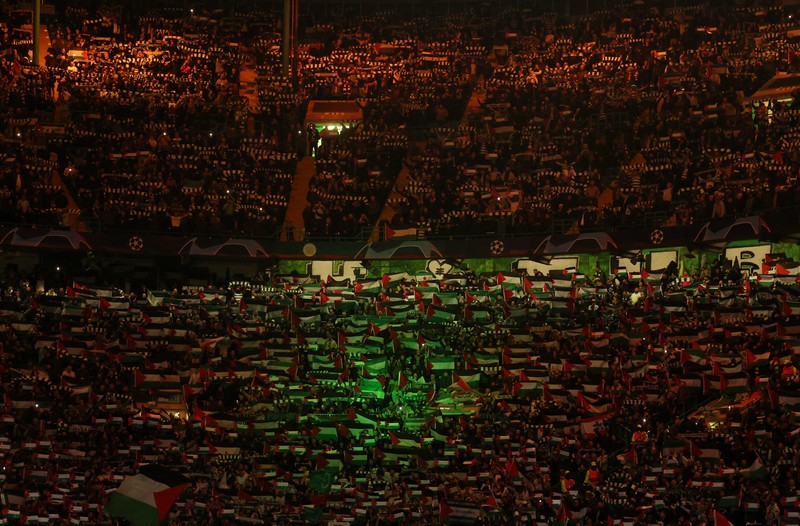 SOCCER-CHAMPIONS-CEL-ATM/REPORT Soccer Football - Champions League - Group E - Celtic v Atletico Madrid - Celtic Park, Glasgow, Scotland, Britain - October 25, 2023 Celtic fans display Palestinian flags in support of Palestine amid the ongoing conflict between Israel and the Palestinian Islamist group Hamas before the match Action Images via Reuters/Jason Cairnduff
