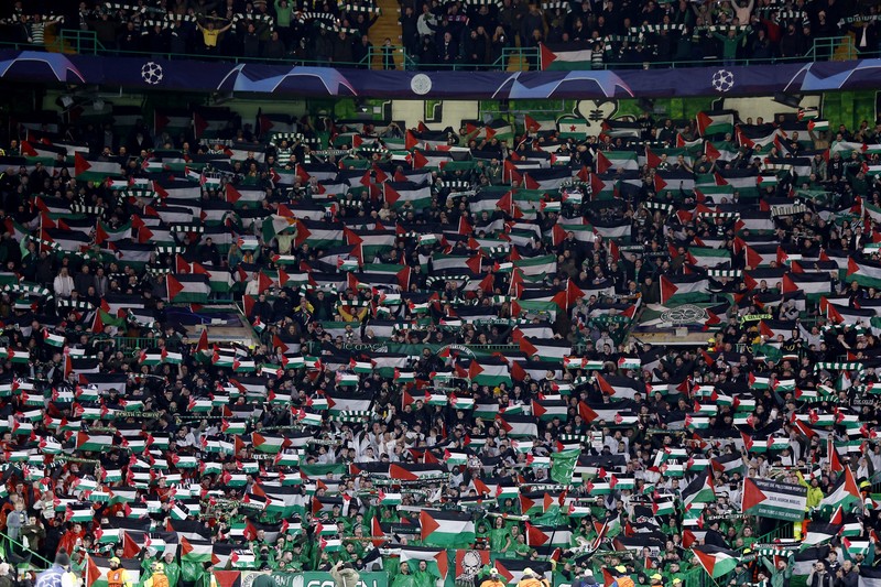 Soccer Football - Champions League - Group E - Celtic v Atletico Madrid - Celtic Park, Glasgow, Scotland, Britain - October 25, 2023 Celtic fans display Palestinian flags in support of Palestine amid the ongoing conflict between Israel and the Palestinian Islamist group Hamas before the match Action Images via Reuters/Jason Cairnduff