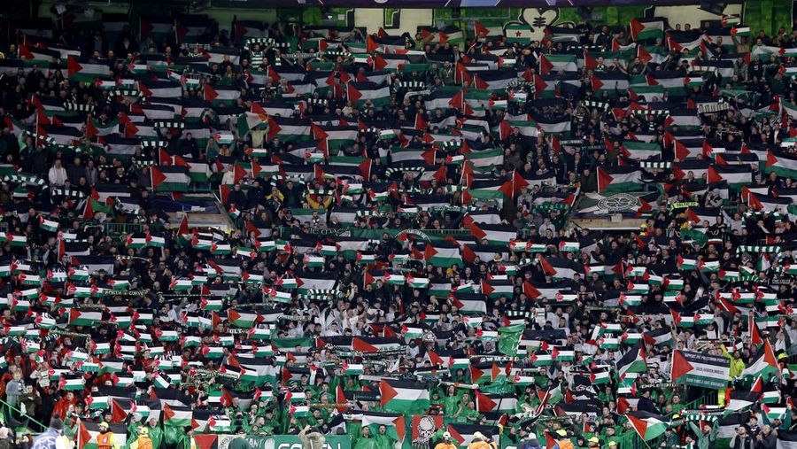 Soccer Football - Champions League - Group E - Celtic v Atletico Madrid - Celtic Park, Glasgow, Scotland, Britain - October 25, 2023 Celtic fans display Palestinian flags in support of Palestine amid the ongoing conflict between Israel and the Palestinian Islamist group Hamas before the match Action Images via Reuters/Jason Cairnduff