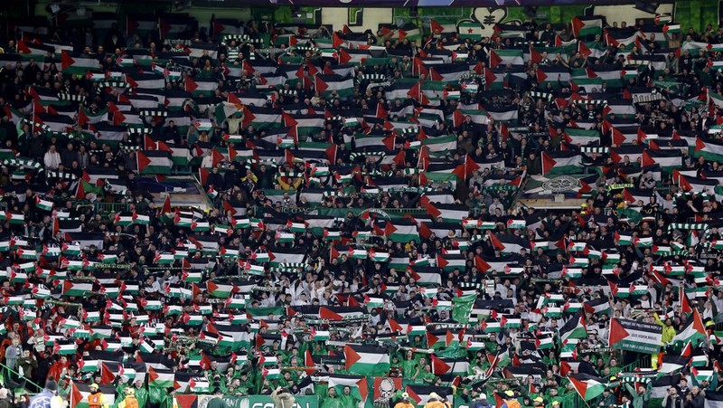 Soccer Football - Champions League - Group E - Celtic v Atletico Madrid - Celtic Park, Glasgow, Scotland, Britain - October 25, 2023 Celtic fans display Palestinian flags in support of Palestine amid the ongoing conflict between Israel and the Palestinian Islamist group Hamas before the match Action Images via Reuters/Jason Cairnduff